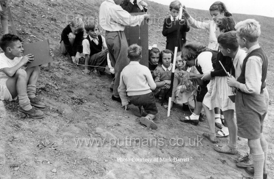 Ref E3 Measuring gradient of sea wall behind School Field c1955